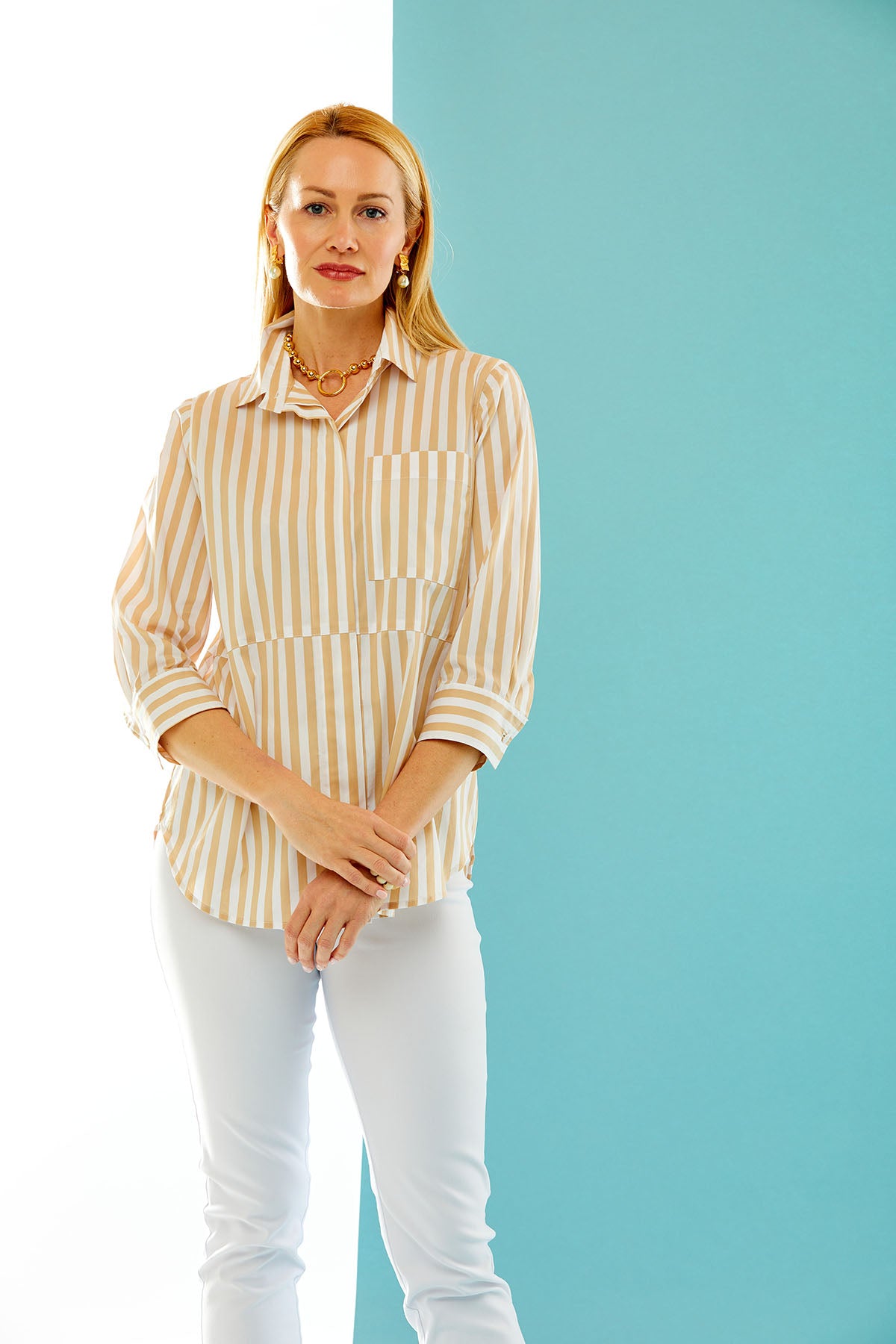 woman wearing khaki & white striped button down with front pocket
