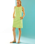 Woman in citrus scalloped dress