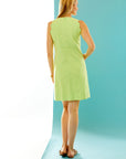 Woman in citrus scalloped dress