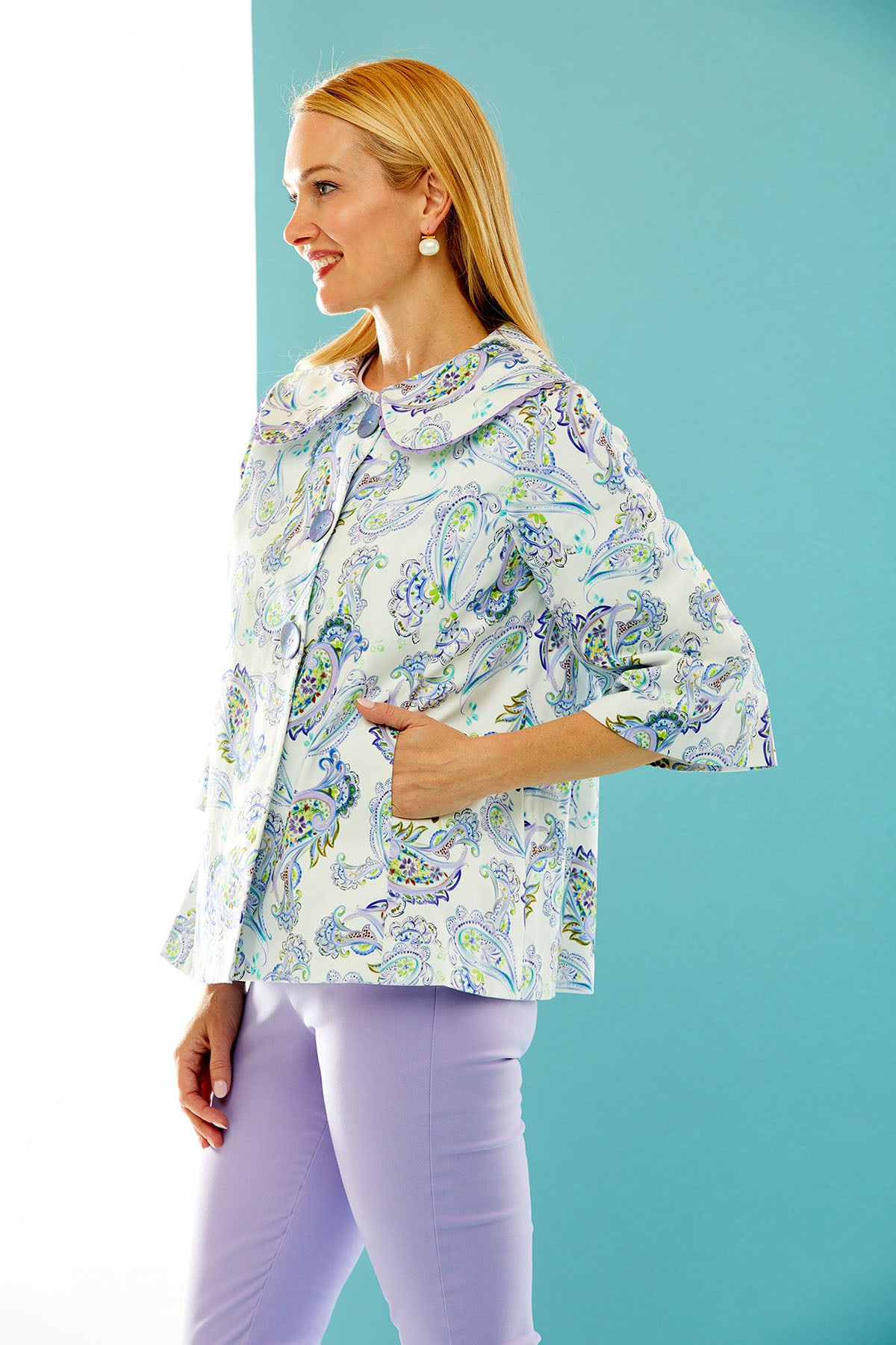 woman in purple paisley print jacket