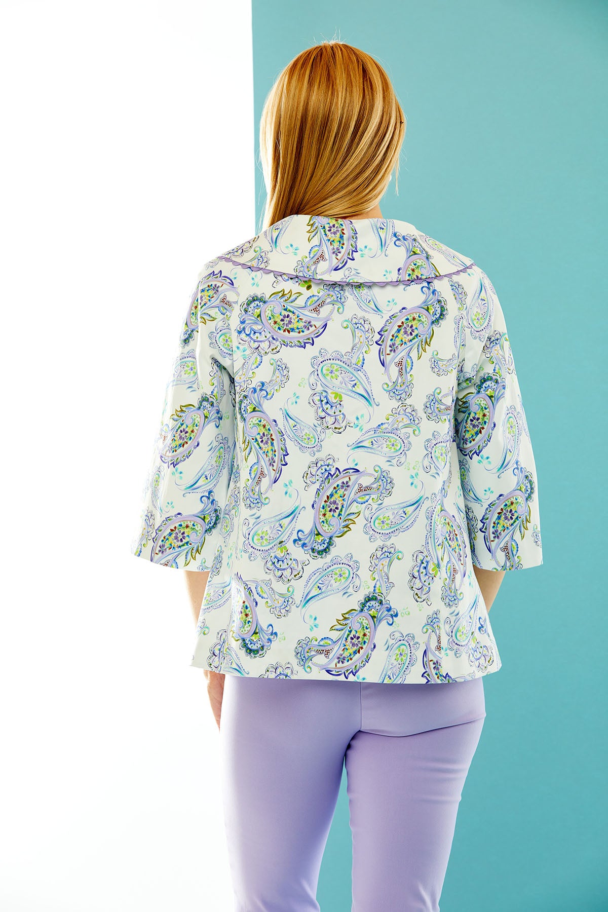 woman in purple paisley print jacket