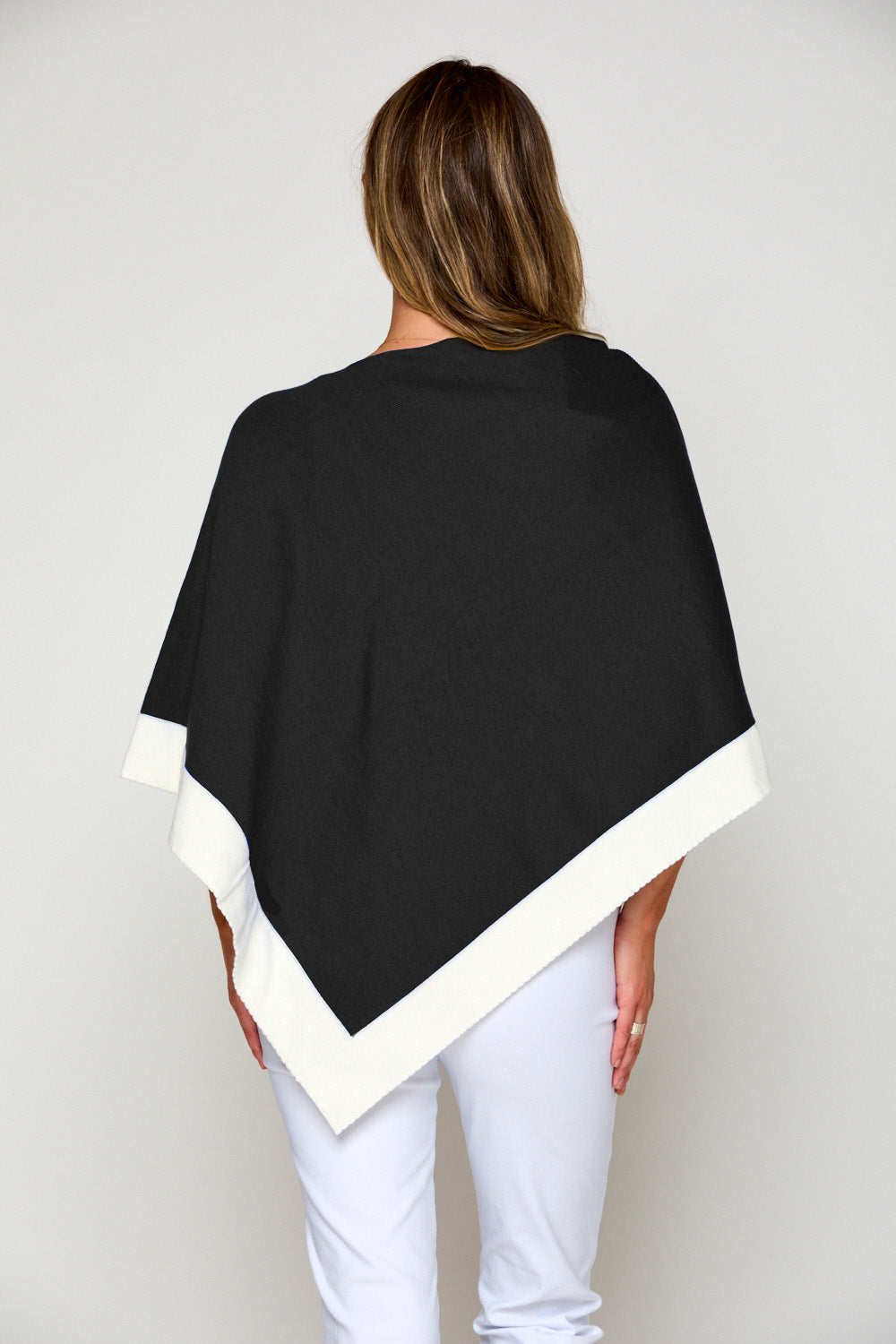 Woman in tipped poncho