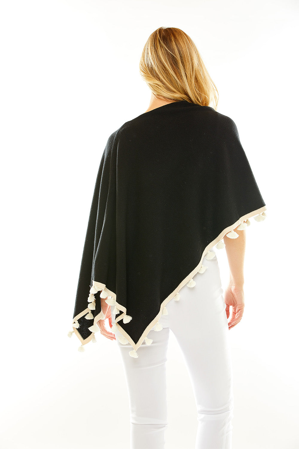 Woman in black/white tassel ruana