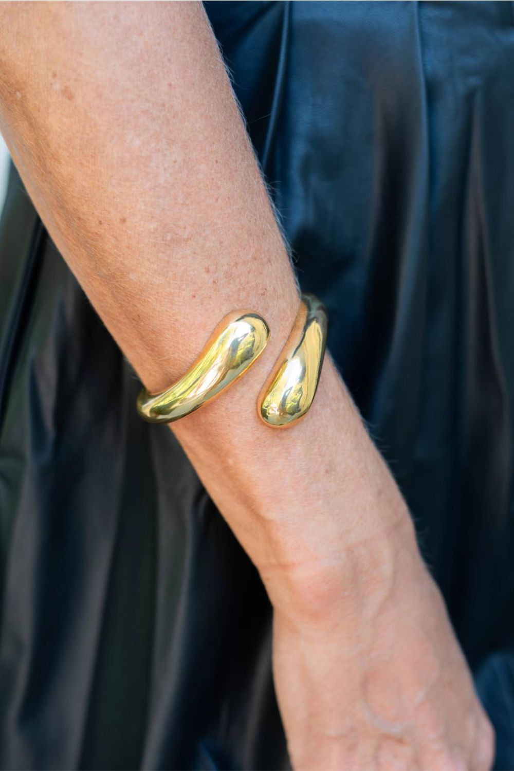 Woman with gold cuff bracelet