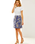 Woman in a blue floral A line skirt