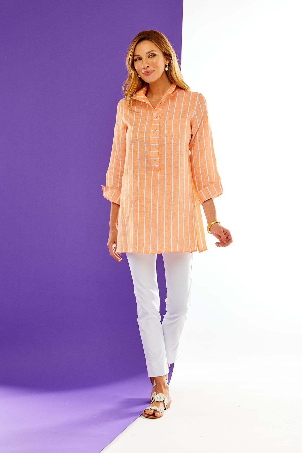 Woman in orange and white stripe tunic