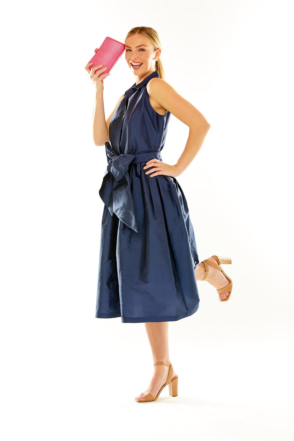 Woman in navy taffeta midi cocktail dress