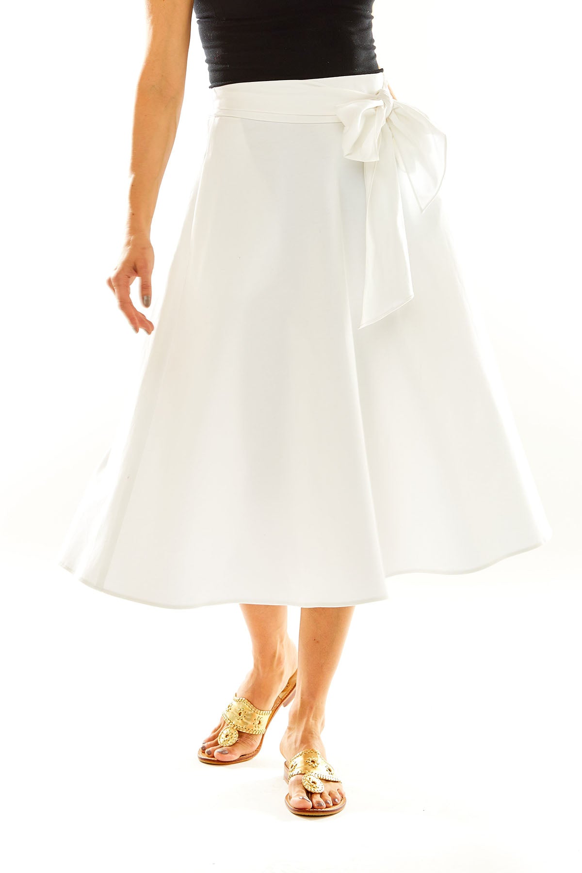 Woman in white midi skirt