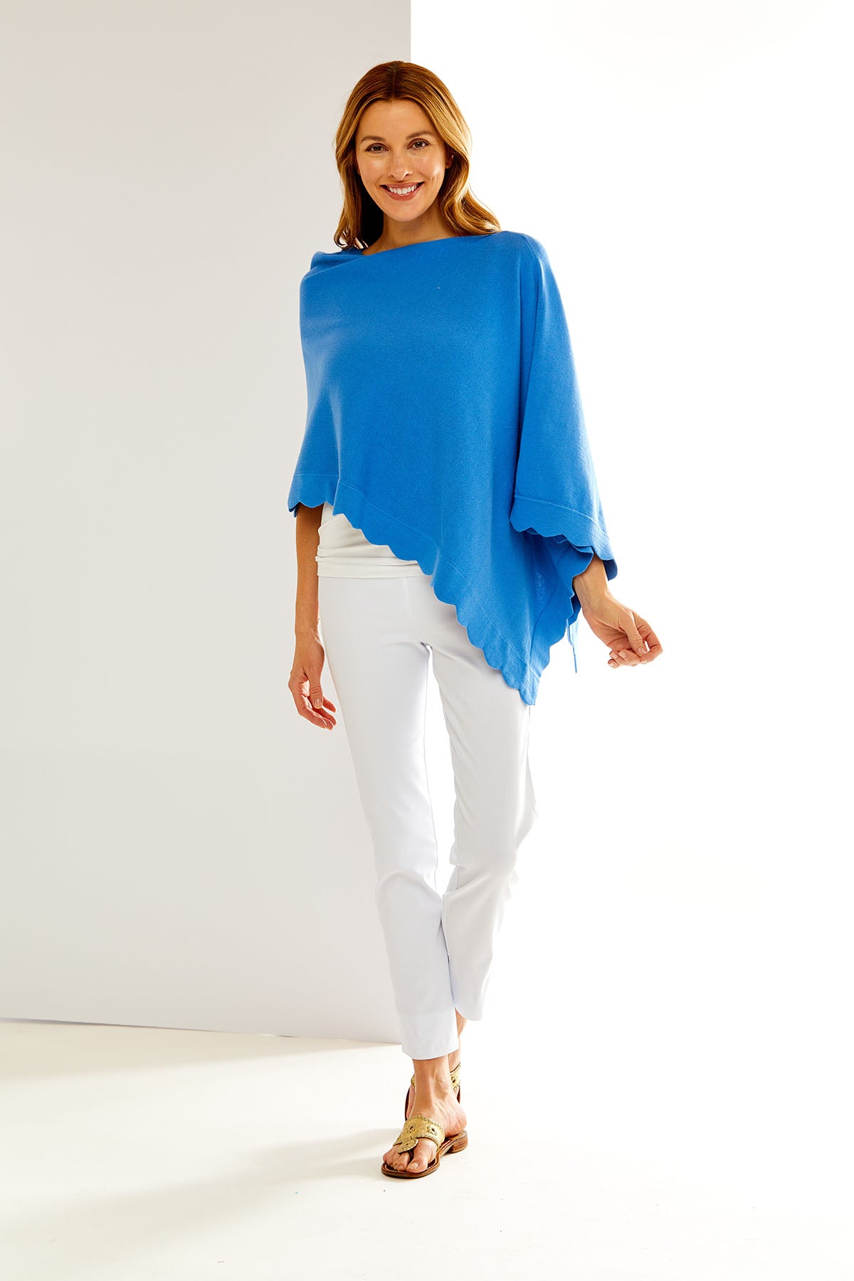 Woman in blue poncho with a scallop hemline