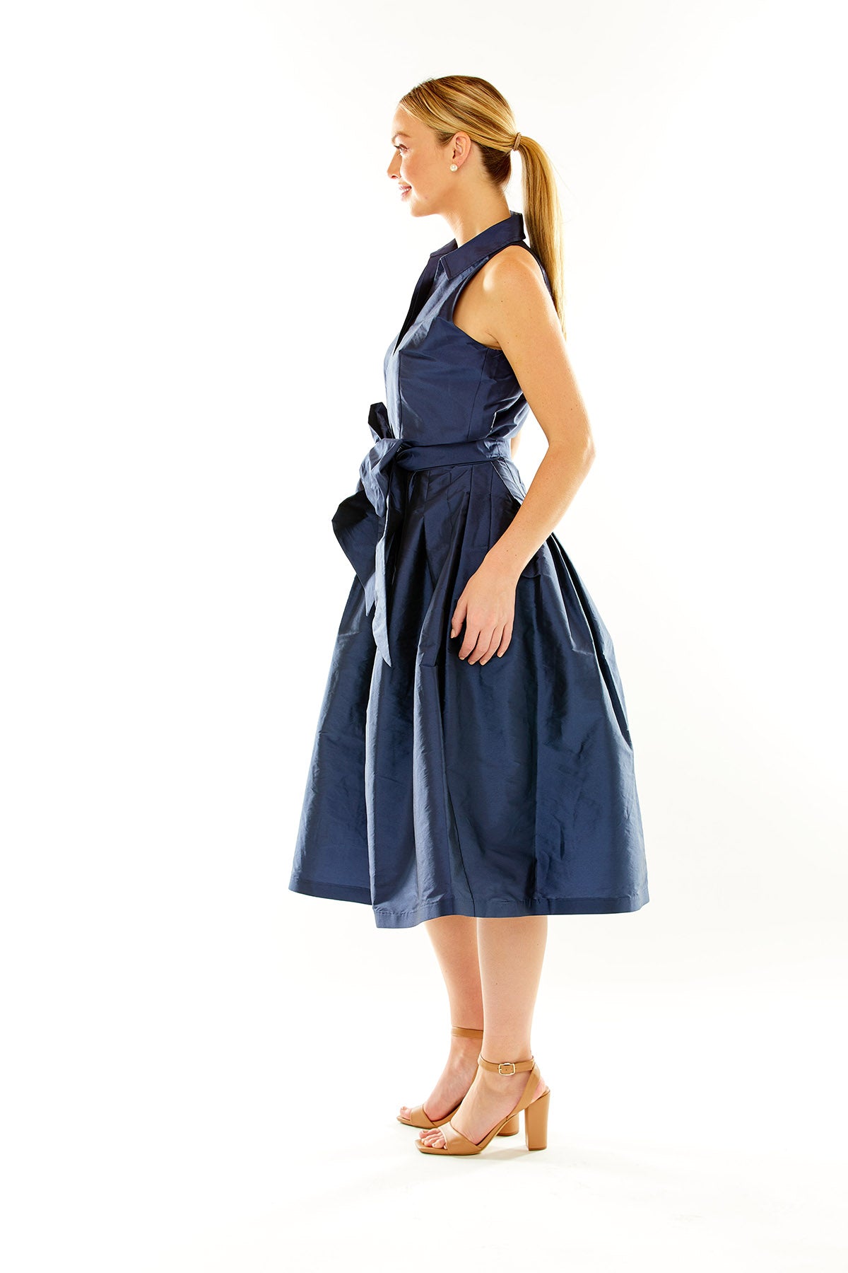 Woman in navy taffeta midi cocktail dress