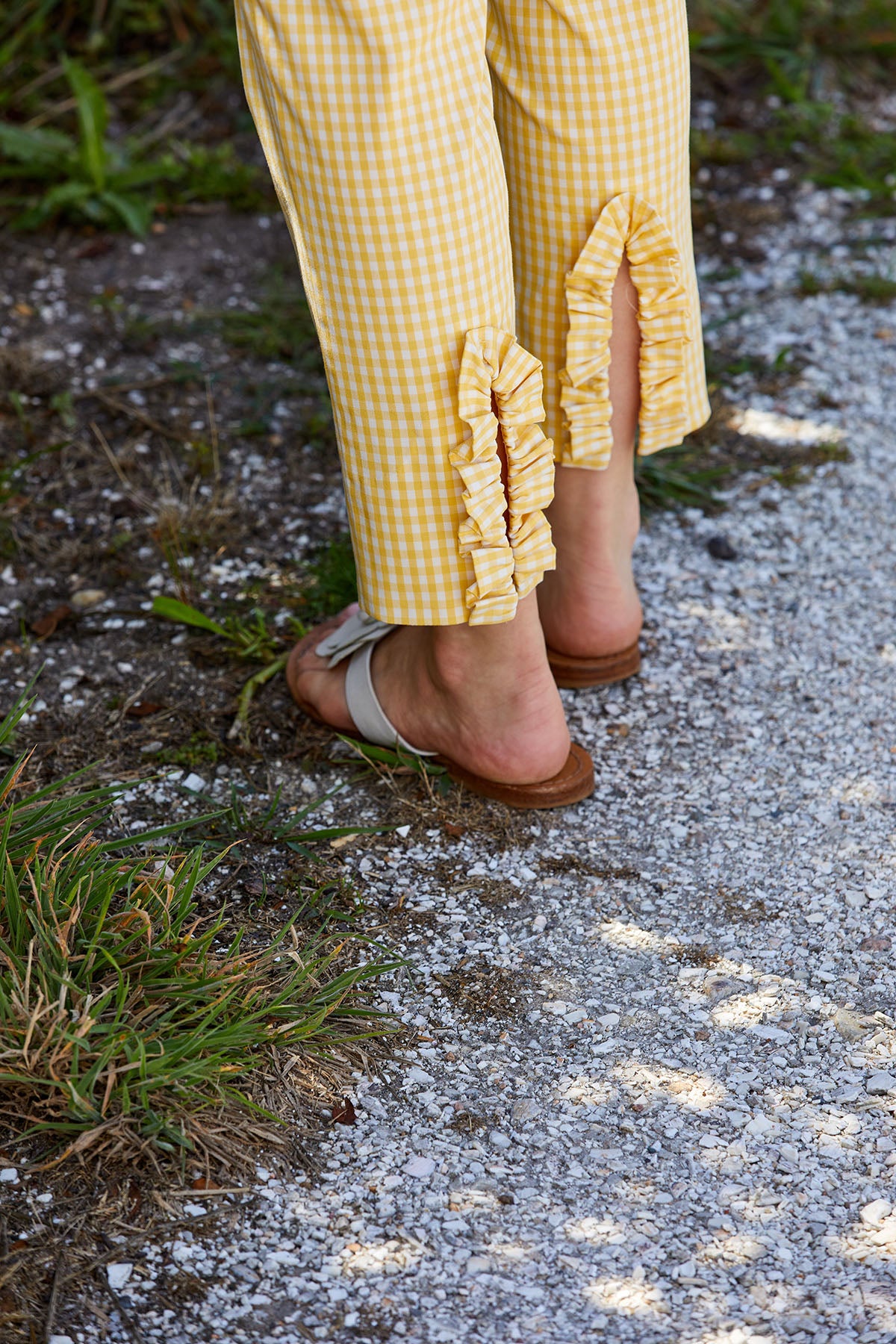 Woman in yellow gingham pants