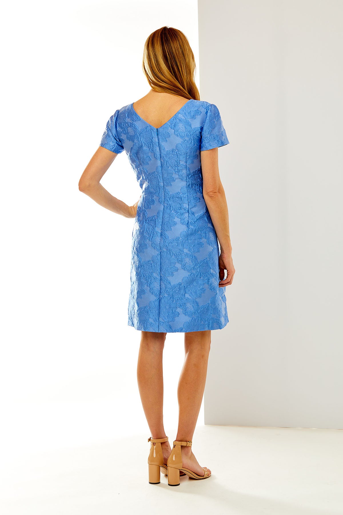 Woman in blue dress with bow