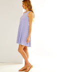 Woman in hyacinth and white stripe dress