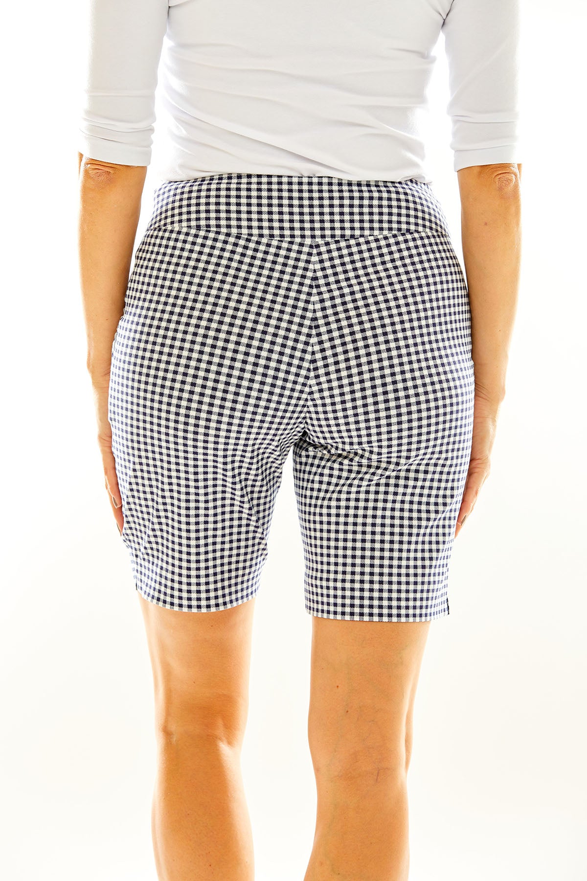 Woman in gingham golf shorts