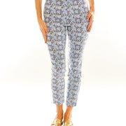 Woman wearing slim fitted pants in a blue floral print