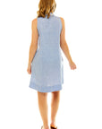 Woman in blue linen dress