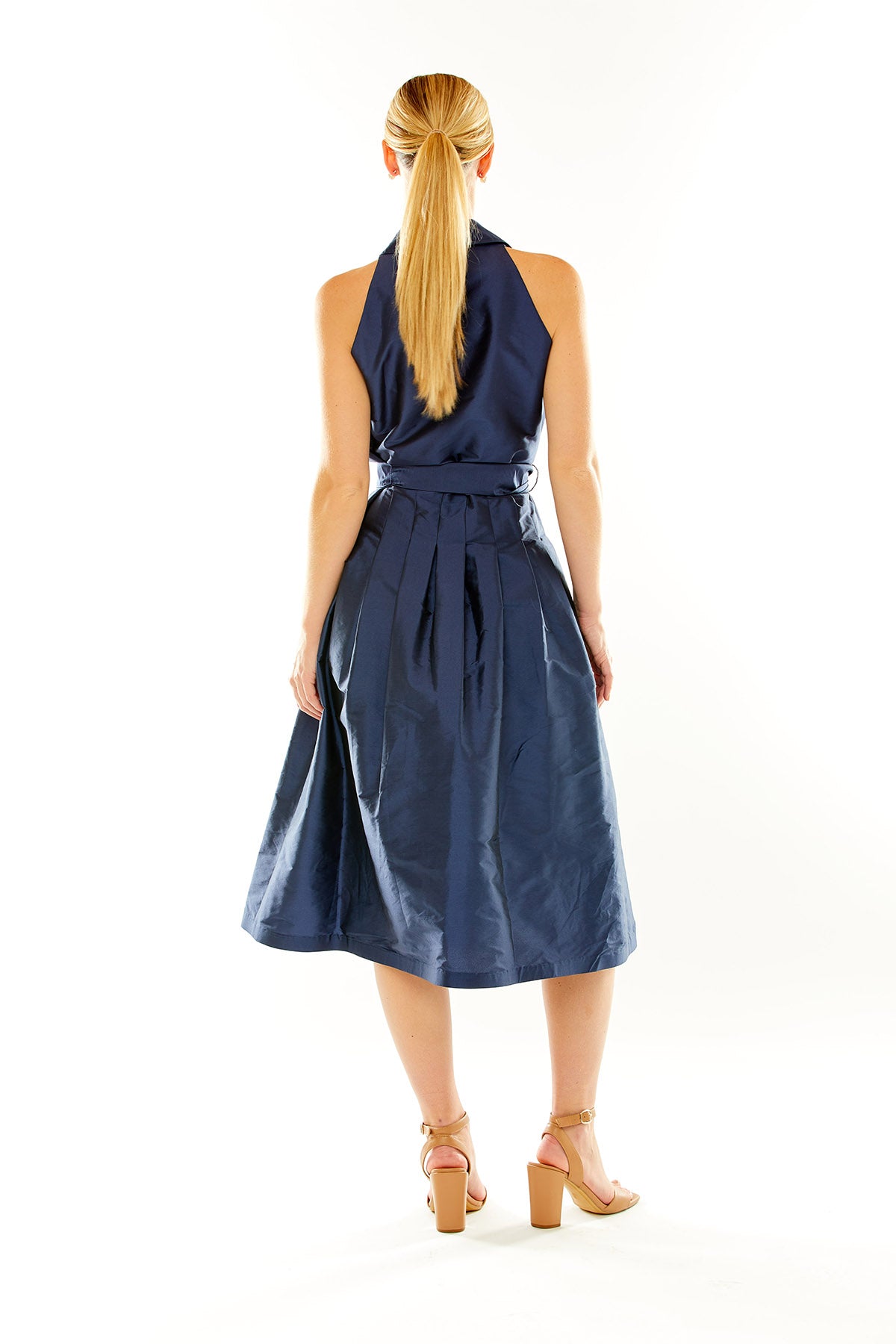 Woman in navy taffeta midi cocktail dress