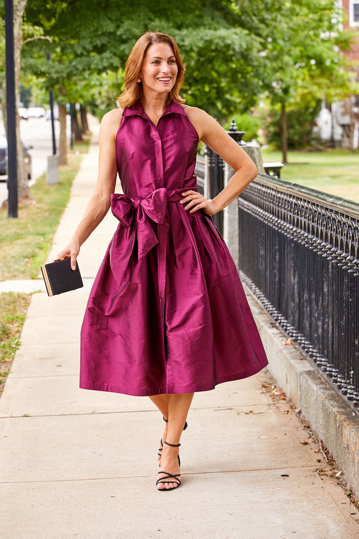 Woman in claret taffeta midi cocktail dress