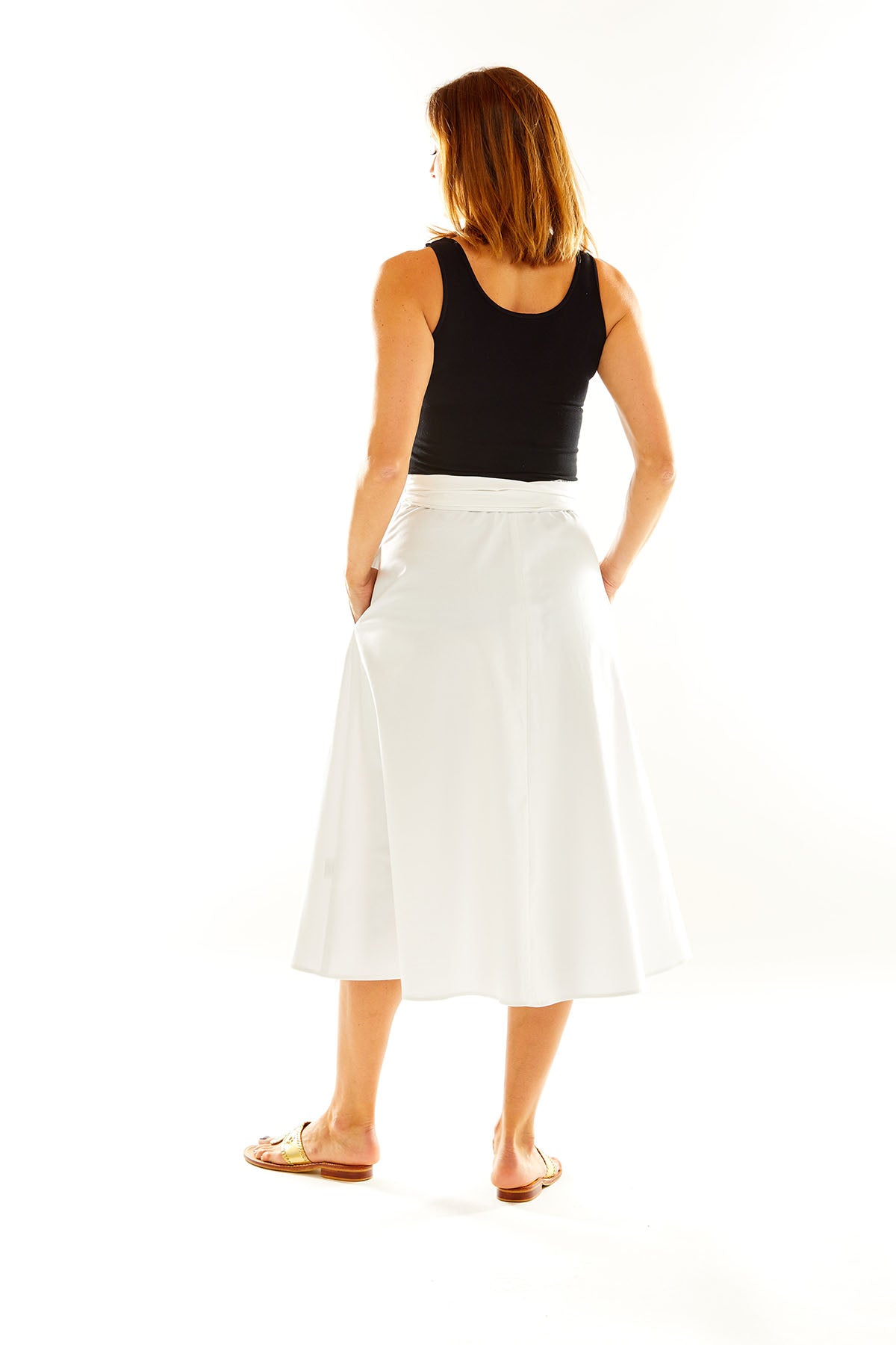 Woman in white midi skirt