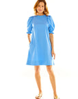 Woman in blue puff sleeve mini dress
