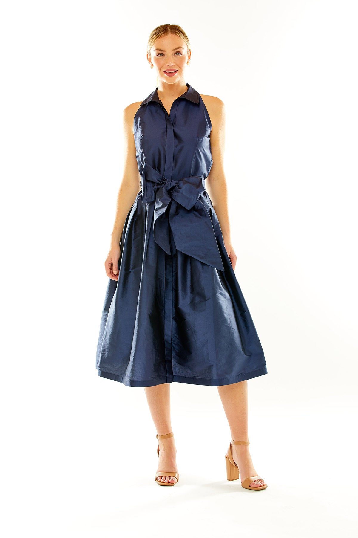 Woman in navy taffeta midi cocktail dress