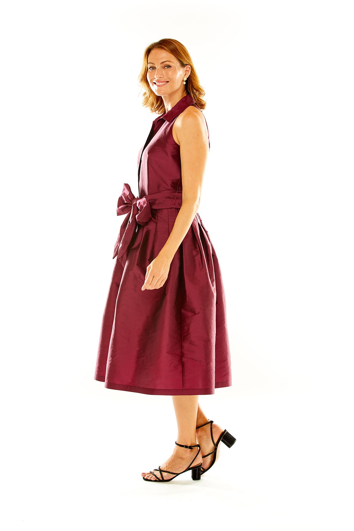 Woman in claret taffeta midi cocktail dress