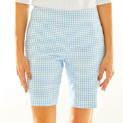 Woman in gingham golf shorts