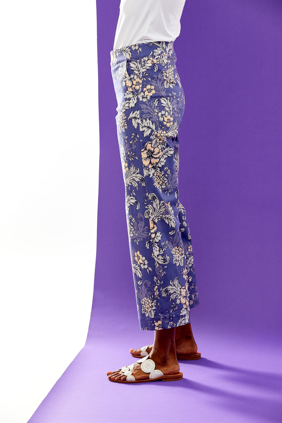 Woman in navy floral pants