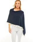 Woman in navy poncho
